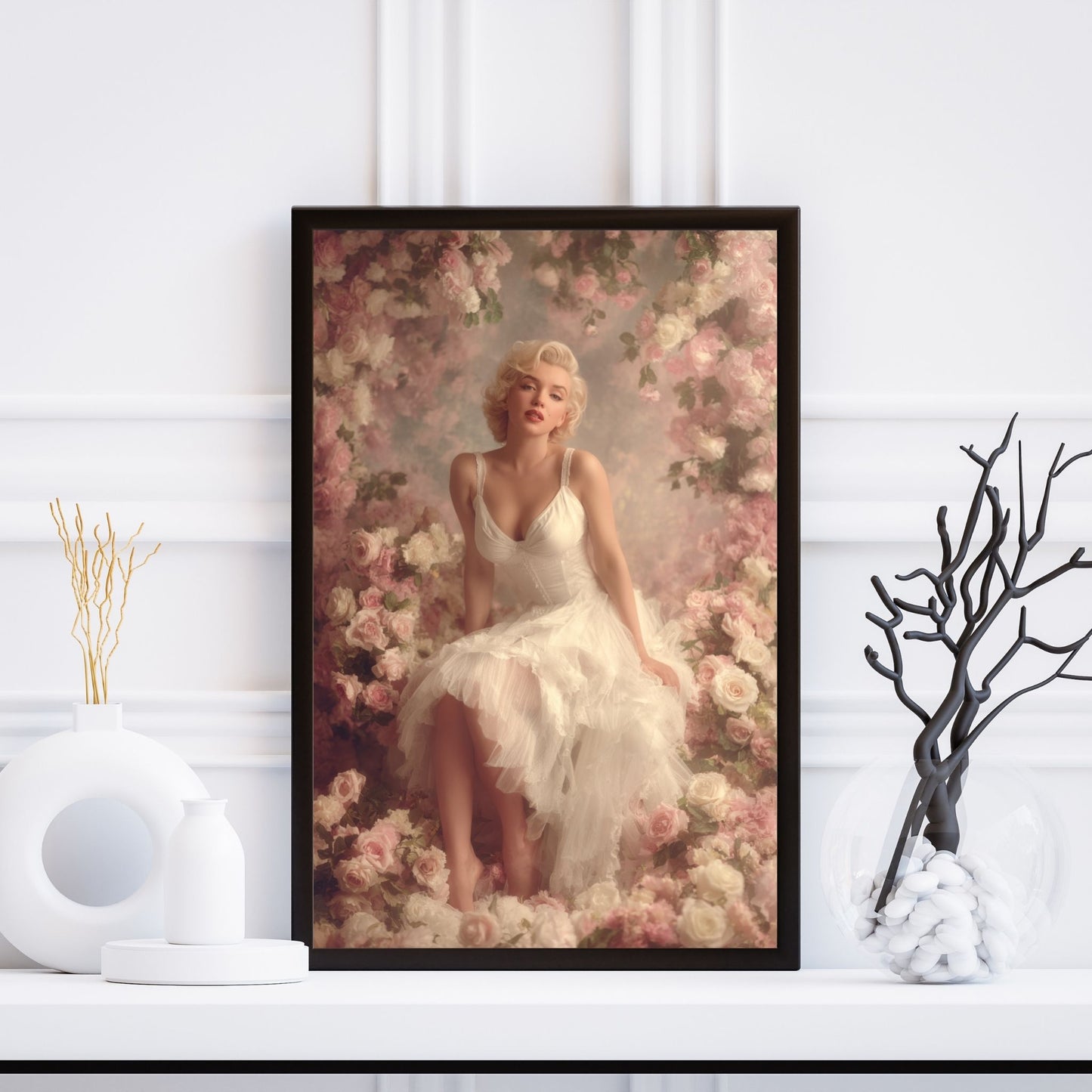 Framed artwork of Marilyn Monroe in a floral setting on a white wall.