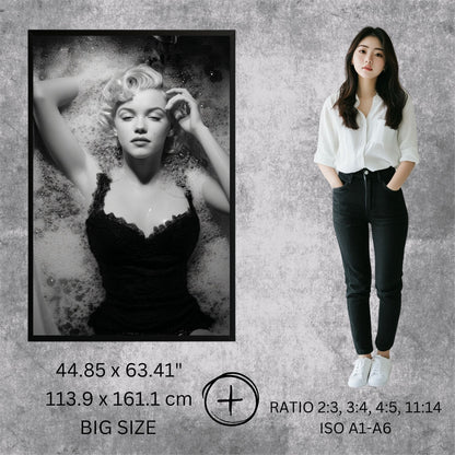 Person standing next to a framed black and white portrait of a famous actress on a textured gray background.