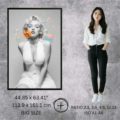 Woman standing next to a framed black and white portrait of a famous actress on a textured gray wall.