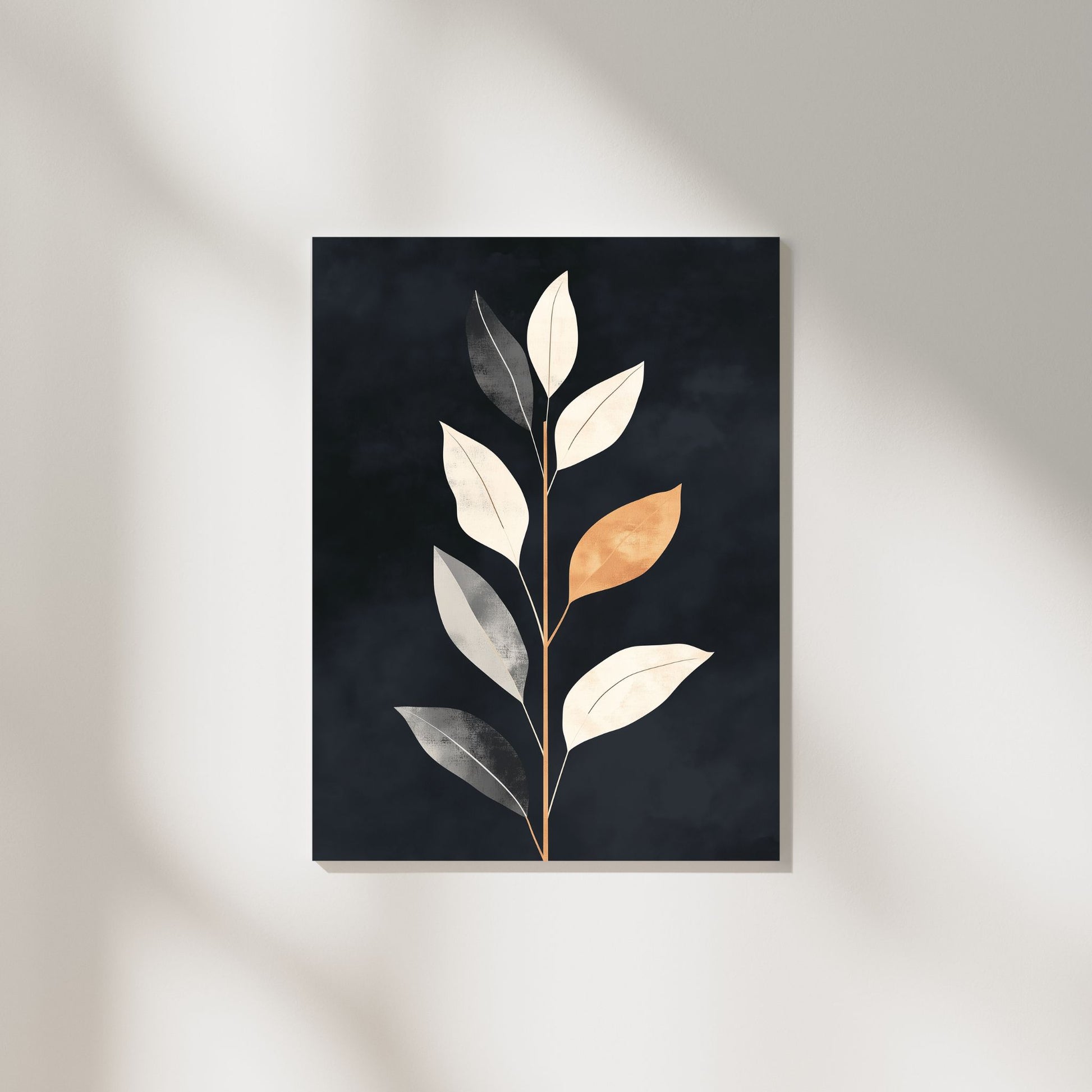 Minimalist botanical wall art featuring gold and neutral leaves on a dark background