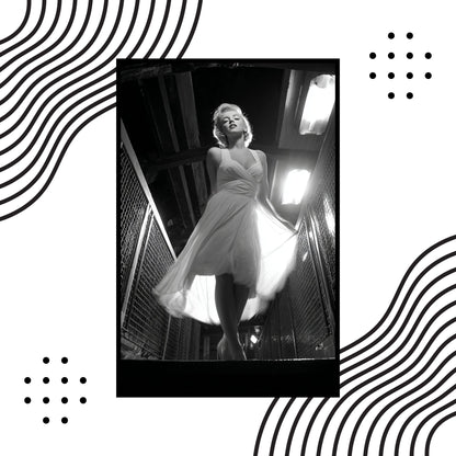 Black and white photo of a woman in a dress with decorative wave patterns on a white background