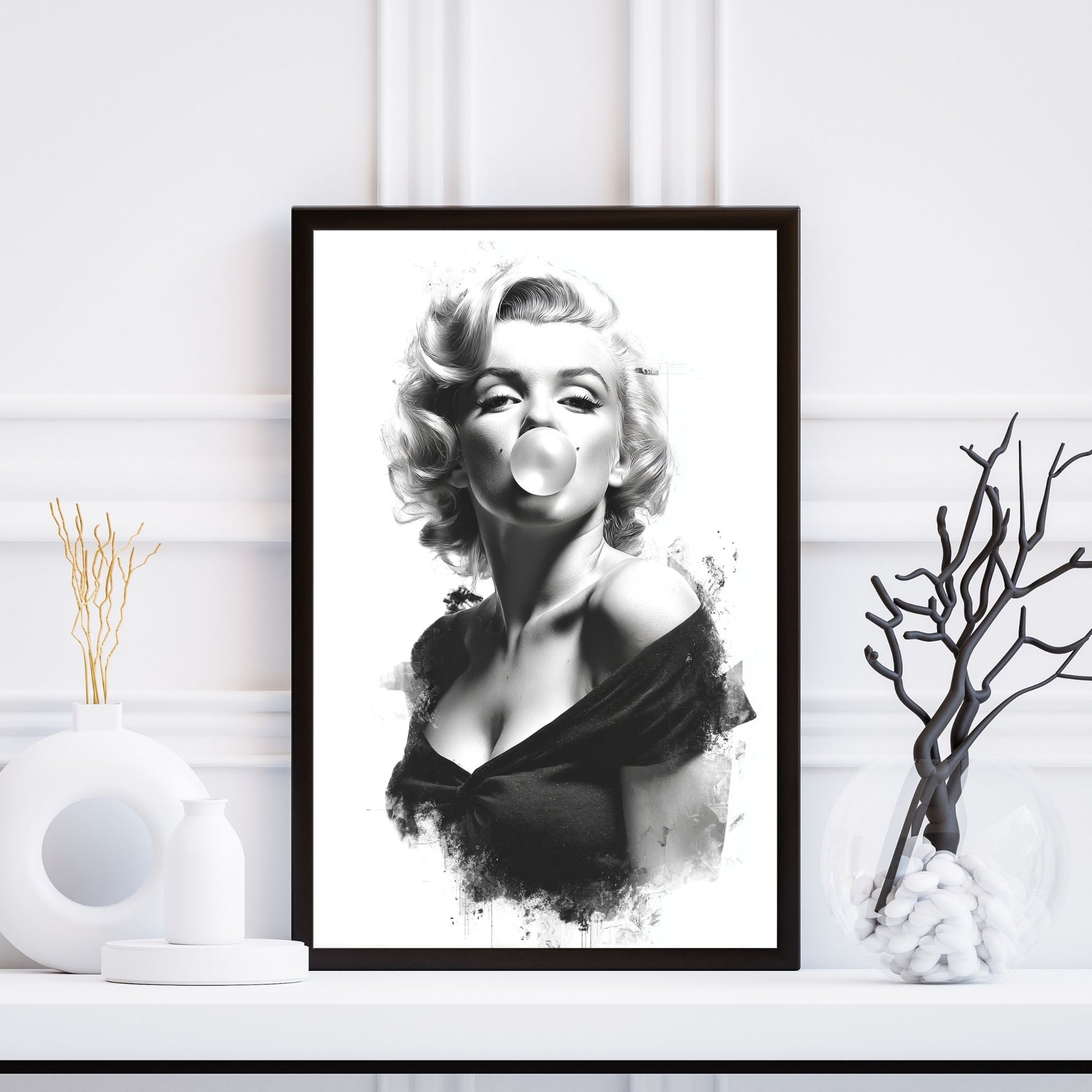 Framed black and white portrait of a famous actress on a white wall.